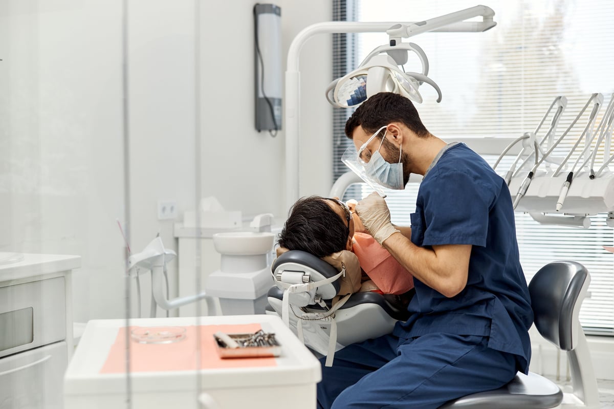 Dentist examining patient
